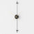 gold and black decorative modern wall clock hang on white wall.